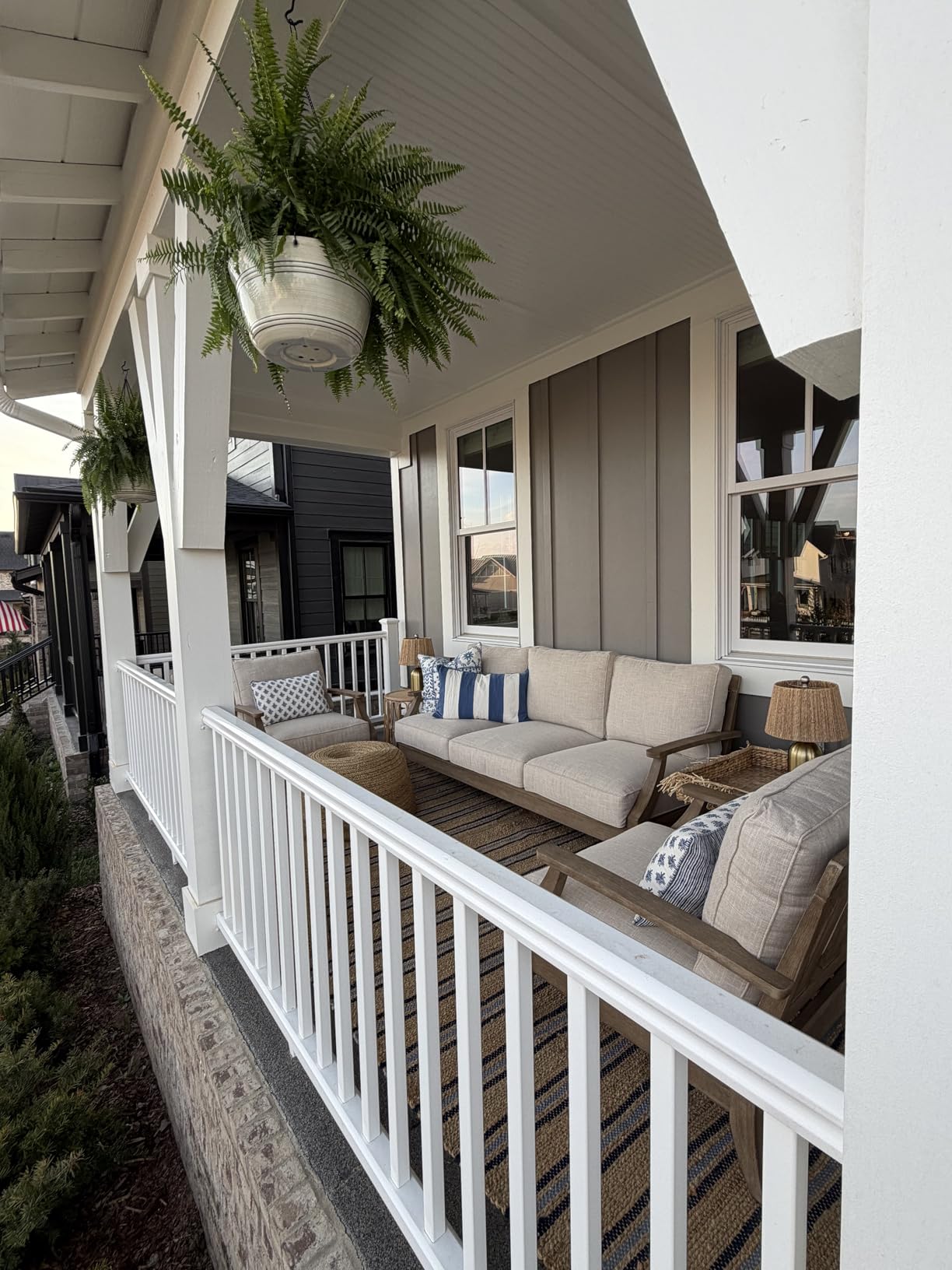 Signature Design by Ashley Clare View Coastal Outdoor Loveseat, Cushioned with Nuvella Fabric, Protective Finish, Eucalyptus Wood, 55.5