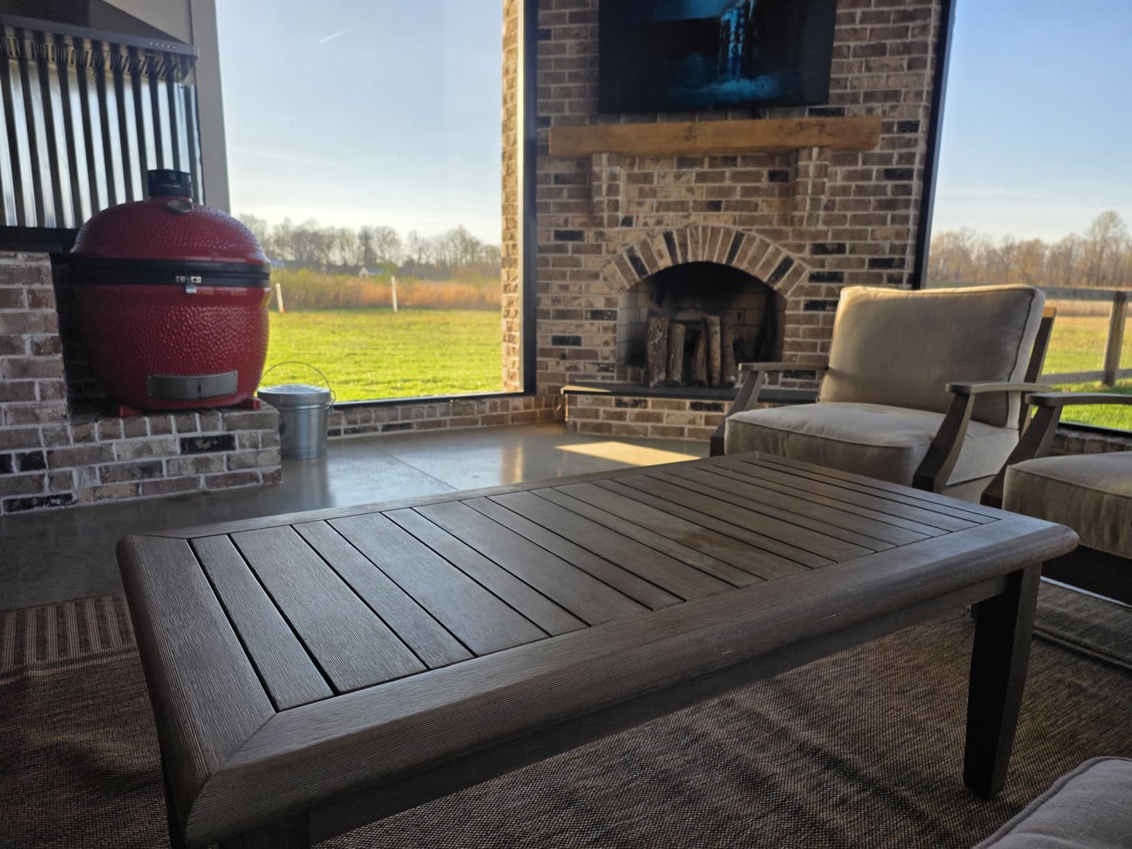 Signature Design by Ashley Gerianne Outdoor Coffee Table, Eucalyptus Wood Outdoor With 5‑Step Protective Finish & Slatted Top for Rain Shedding, Durable Patio Table, Brown customer photo 1