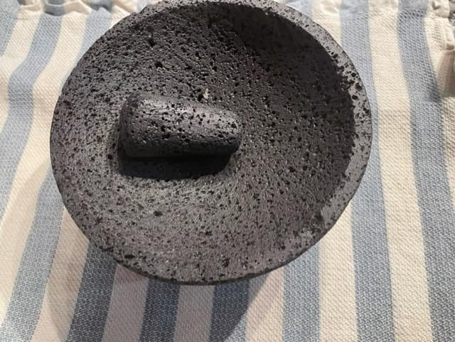 Mexican Molcajete Bowl with Tortilla Basket by Verve Culture, Basalt Volcanic Stone Mortar and Pestle, Rough Surfaced Mexican Kitchenware for Mixing and Grinding, Oven Safe, 7