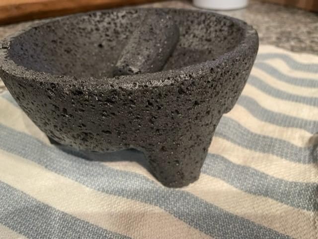 Mexican Molcajete Bowl with Tortilla Basket by Verve Culture, Basalt Volcanic Stone Mortar and Pestle, Rough Surfaced Mexican Kitchenware for Mixing and Grinding, Oven Safe, 7