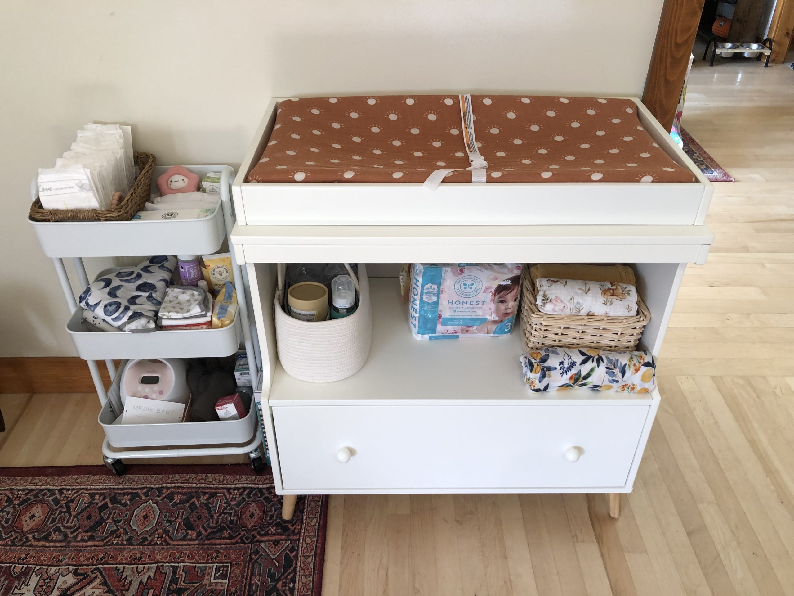Delta Children Essex Convertible Changing Table with Drawer, Bianca White/Natural customer photo 1