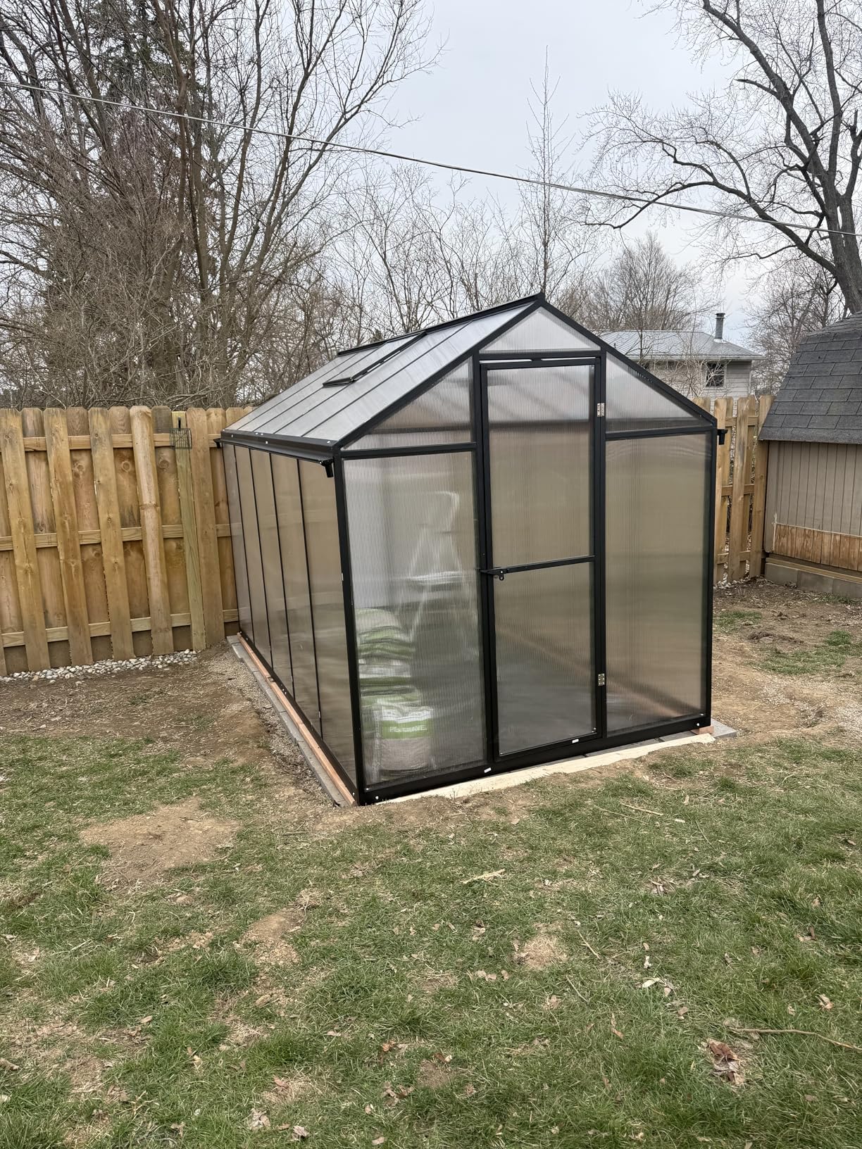 Aoodor 6 x 10 Ft Walk-in Greenhouse with Gutter, Polycarbonate and Heavy-Duty Aluminum Frame, Adjustment Skylight and Lockable 2-Sided Door for Patio, Outdoor, Yard, Lawn Use, Black customer photo 1