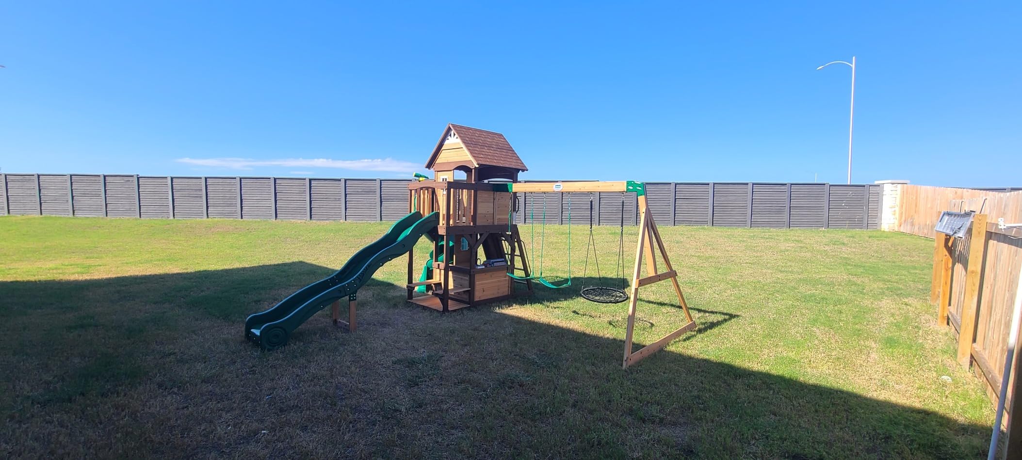 Backyard Discovery Cedar Cove Wood Swing Set with Spiral Tube and Wave Slide, Clubhouse, Toy Grill, Snack Bar, Rock Wall, Belt Swings, Web Swing, Balcony, Chalkboard, Ladder, Outdoor Playset customer photo 2