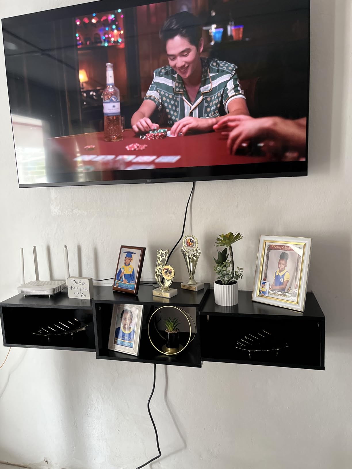 IBUYKE Floating TV Stand Wall Mounted with Power Outlet, Modern Wood Wall Mounted Media Console Shelf, Floating Entertainment Center for Under TV Storage for Living Room Bedroom Office, Black WST001B- customer photo 1