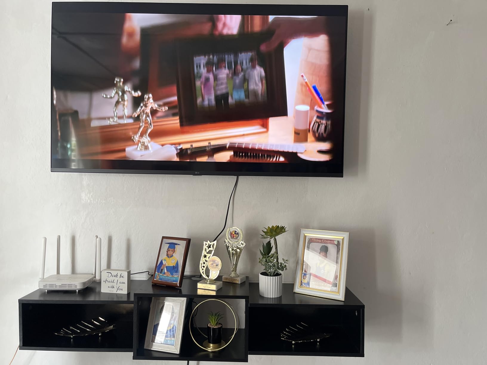 IBUYKE Floating TV Stand Wall Mounted with Power Outlet, Modern Wood Wall Mounted Media Console Shelf, Floating Entertainment Center for Under TV Storage for Living Room Bedroom Office, Black WST001B- customer photo 2