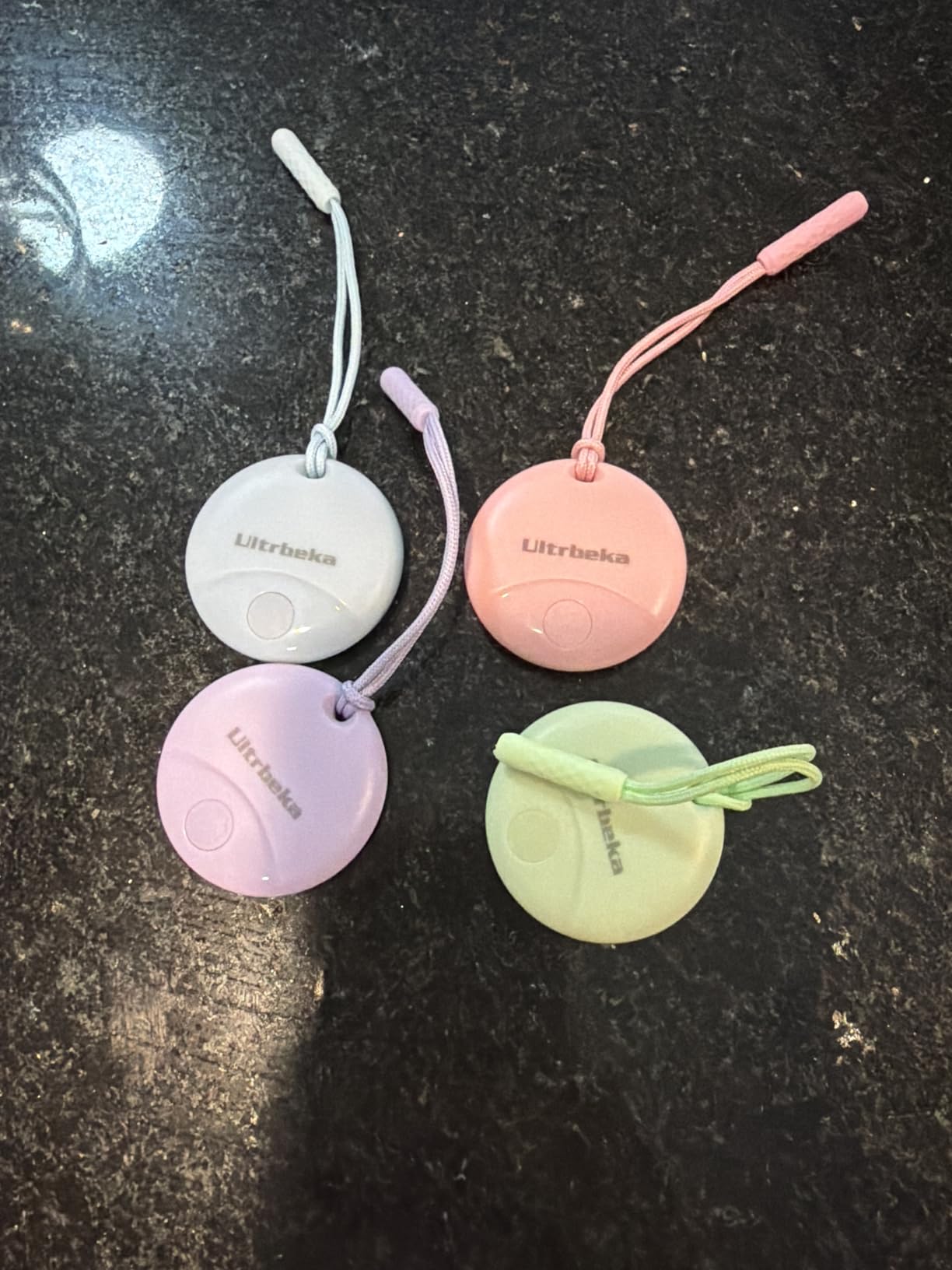 Ultrbeka Air Tracker Tag 4 Pack Bluetooth Item Finder for iPhone - MFi Certified Smart Tracker Compatible with Apple Find My, IP67 Waterproof Key Finder for Keys, Wallet, Luggage, Bike, Backpack customer photo 1