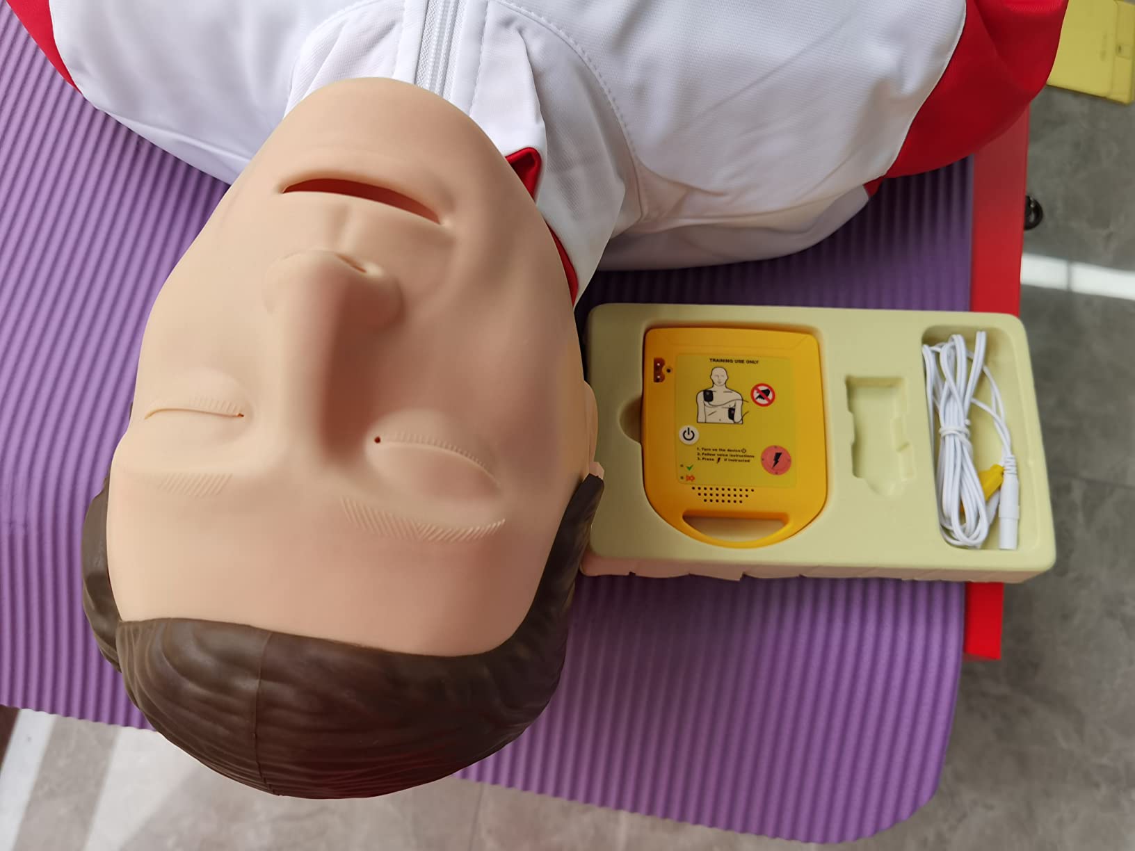 AED Trainer, AED Defibrillator Trainer Set CPR Training Device, English, Italian, French, Spanish Voice Prompts, 5 Different Scenarios, First Aid Defibrillator Trainee Beginner, XFT-120NB Training AED customer photo 2