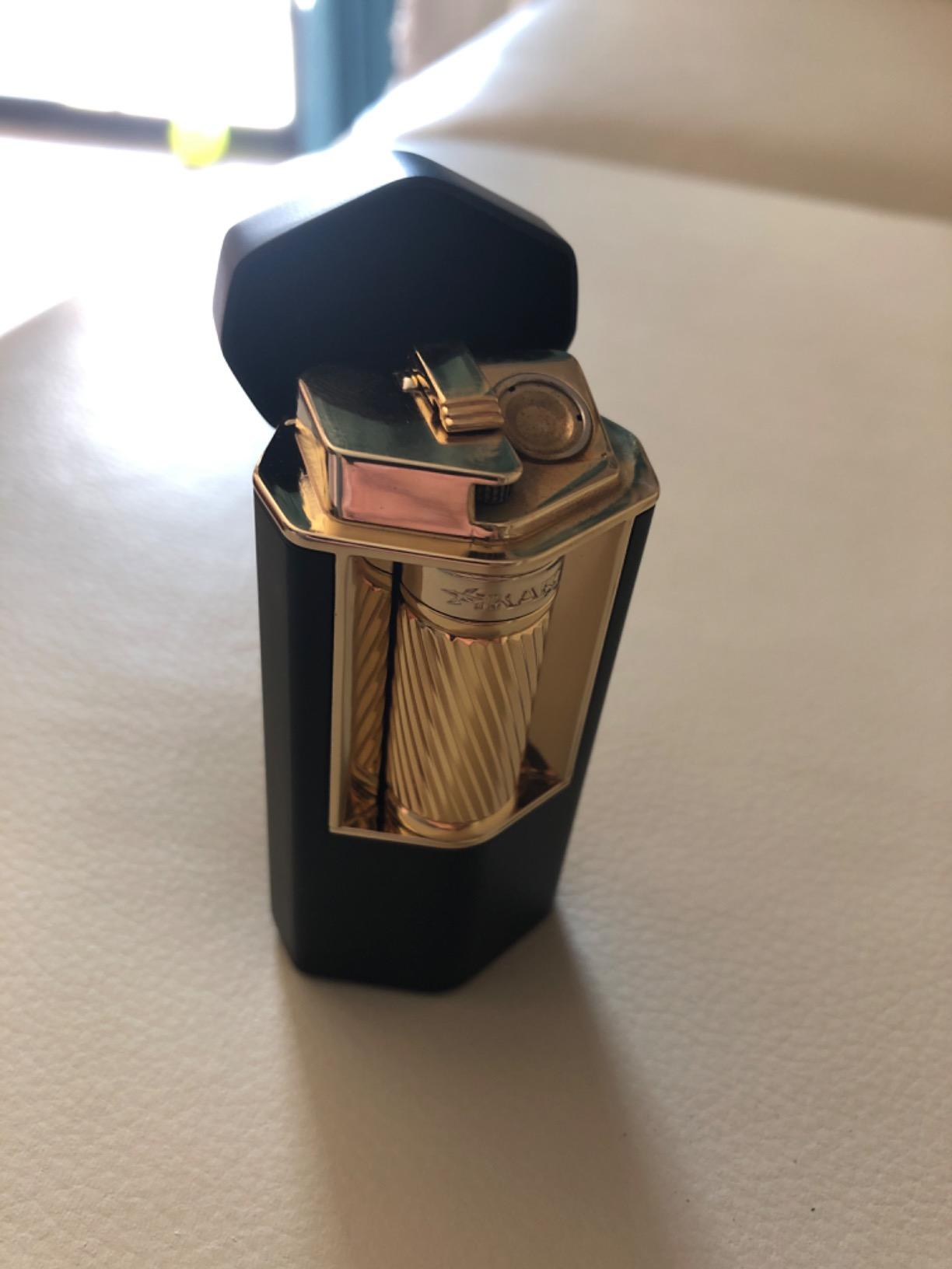 Xikar Meridian Triple Soft Flame Cigar Lighter, Powerful, Elegant, Innovative, Reliable Flint Ignition, Large Easy-to-Use Roller Bar, EZ-View Fuel Window, High Altitude Performance, Black & Gold customer photo 1