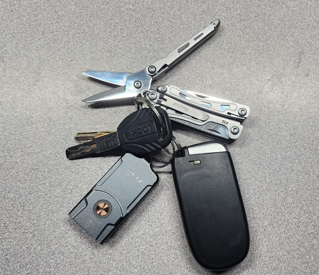 NexTool Mini Flagship F12 Keychain Multitool, 15-in-1 Multi Tool, 80Cr14Mov Steel, Serrated Scissors, Thicken Pliers, Safety Lock Knife and File for EDC, Outdoor, DIY (Silver) customer photo 2