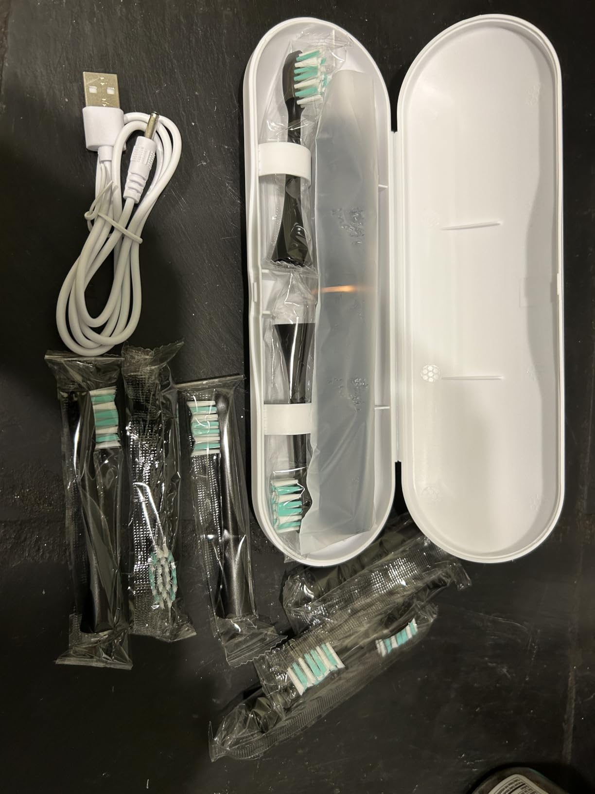 kingheroes Electric Toothbrush Set, Comes with 8 Brush Heads & Travel Case,4 Modes with 2 Minutes Built in Smart Timer, One Charge for 60 Days, 42000 VPM Motor (Black) customer photo 1