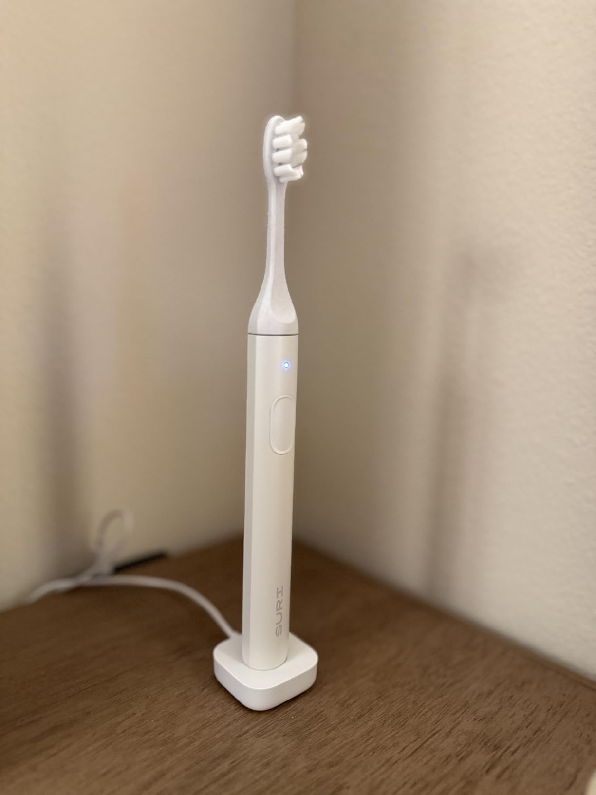 SURI Pro Sonic Electric Toothbrush | Over 4+ Weeks Battery | UV Cleaning Travel Case | Pressure Sensor | Aluminium Body | 2-Minute Timer | Plant-Based Heads | Green customer photo 2